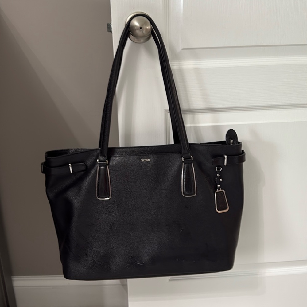 Tumi black ladies briefcase in good condition.